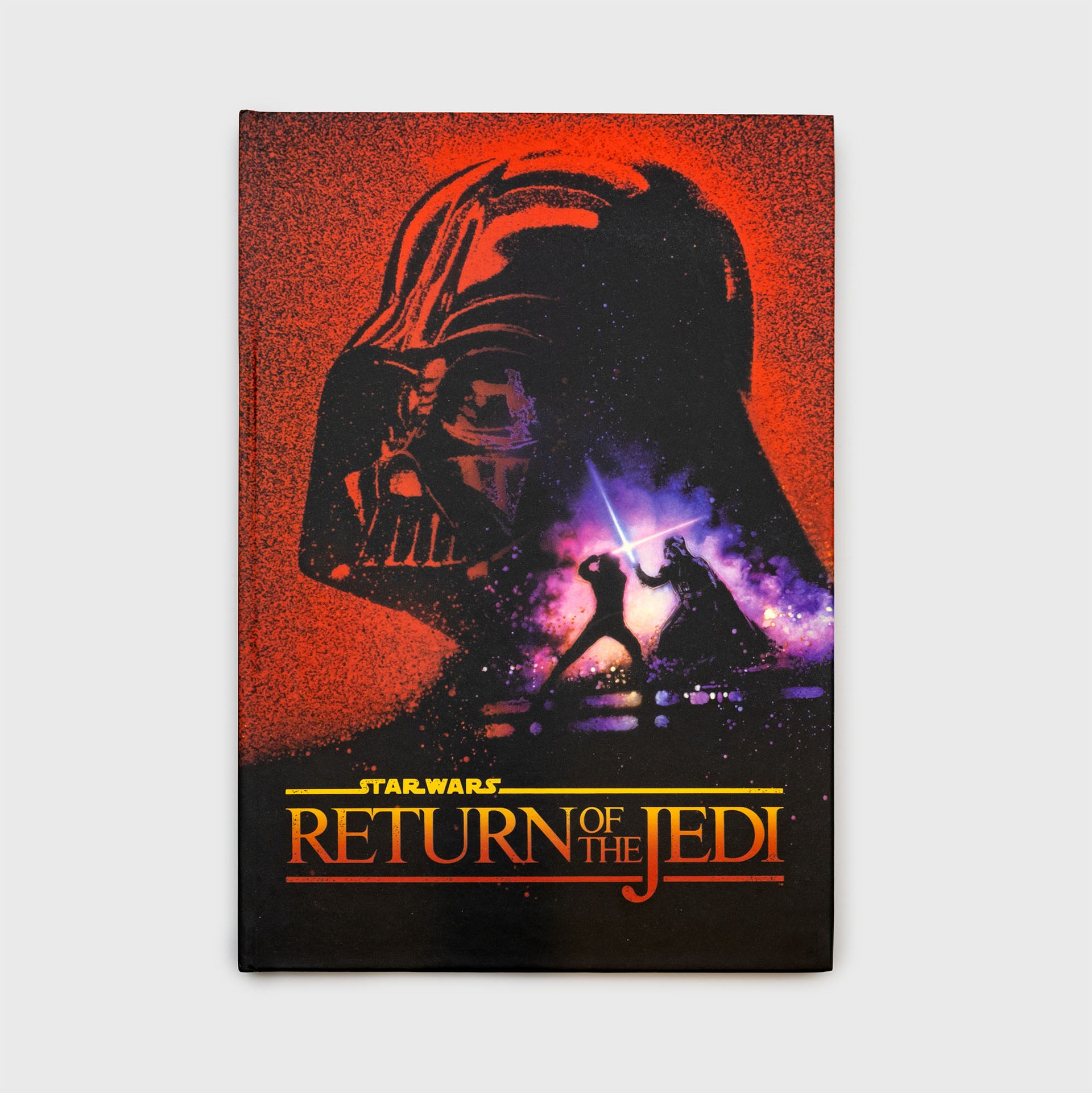 return of the jedi notebook. darth vaders head. luke and darth vader battling with ligthsabers. text: star wars return of the jedi