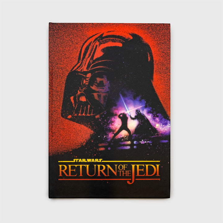 return of the jedi notebook. darth vaders head. luke and darth vader battling with ligthsabers. text: star wars return of the jedi