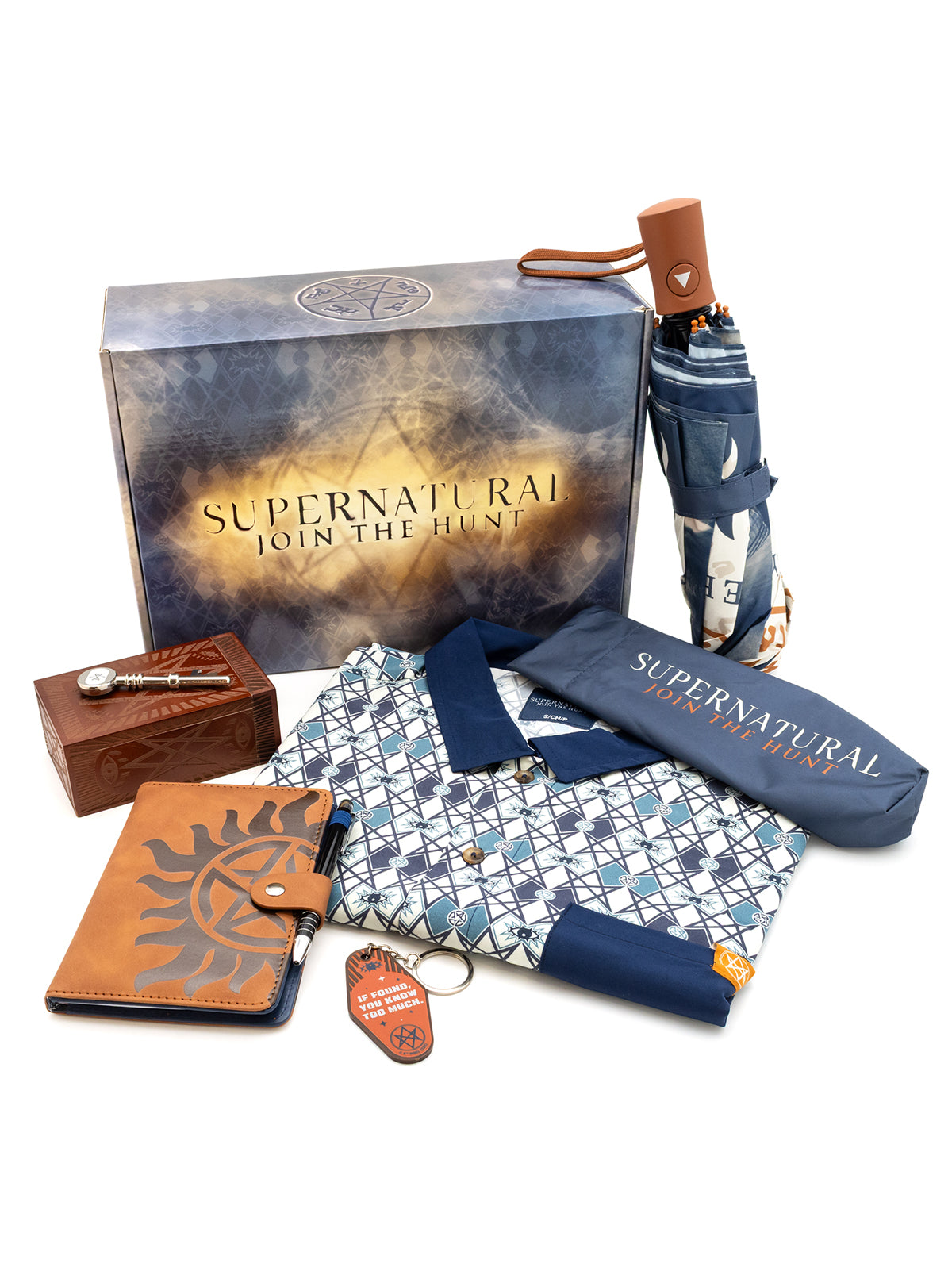 full supernatural box wit contents. umbrella, umbrella cover, button down shirt, keychain, journal with pen, key with box.