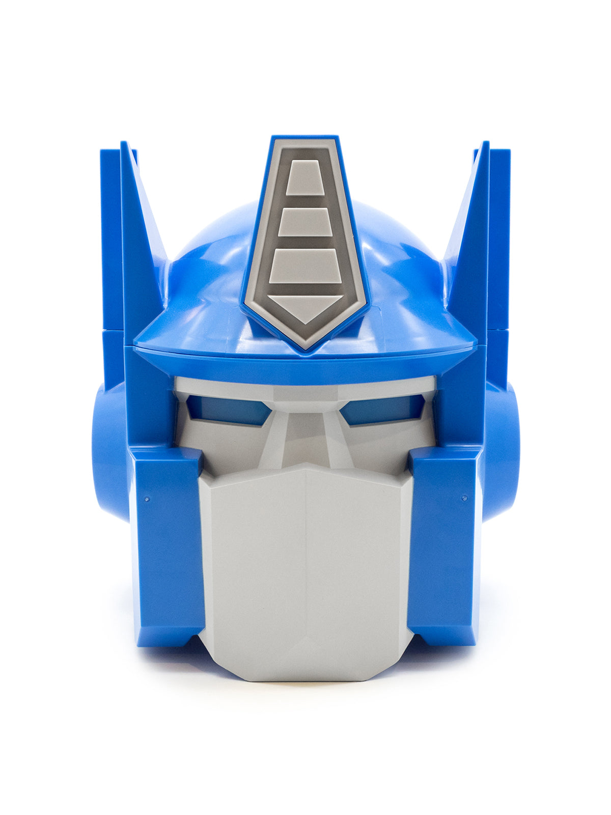 A blue and gray Optimus Prime toy helmet or decorative headpiece, photographed from the front on a clean white background.