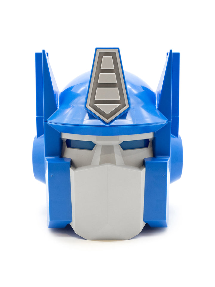 A blue and gray Optimus Prime toy helmet or decorative headpiece, photographed from the front on a clean white background.