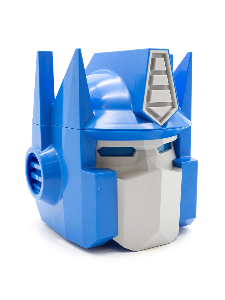 A blue and white Optimus Prime helmet-shaped container or decor piece, photographed on a clean white background.