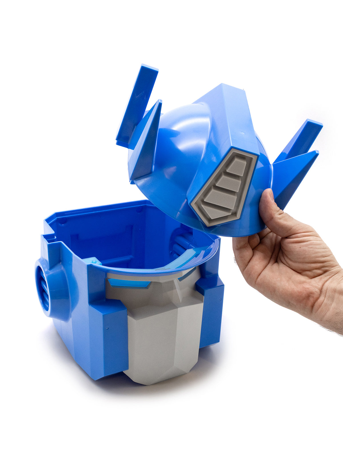 A blue and gray robot-themed storage container with a matching lid being held by a hand, set against a plain white background.