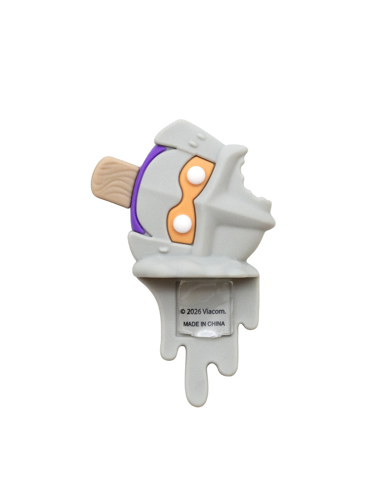 A novelty popsicle figure featuring a melted character head with purple and orange details, a wooden stick
