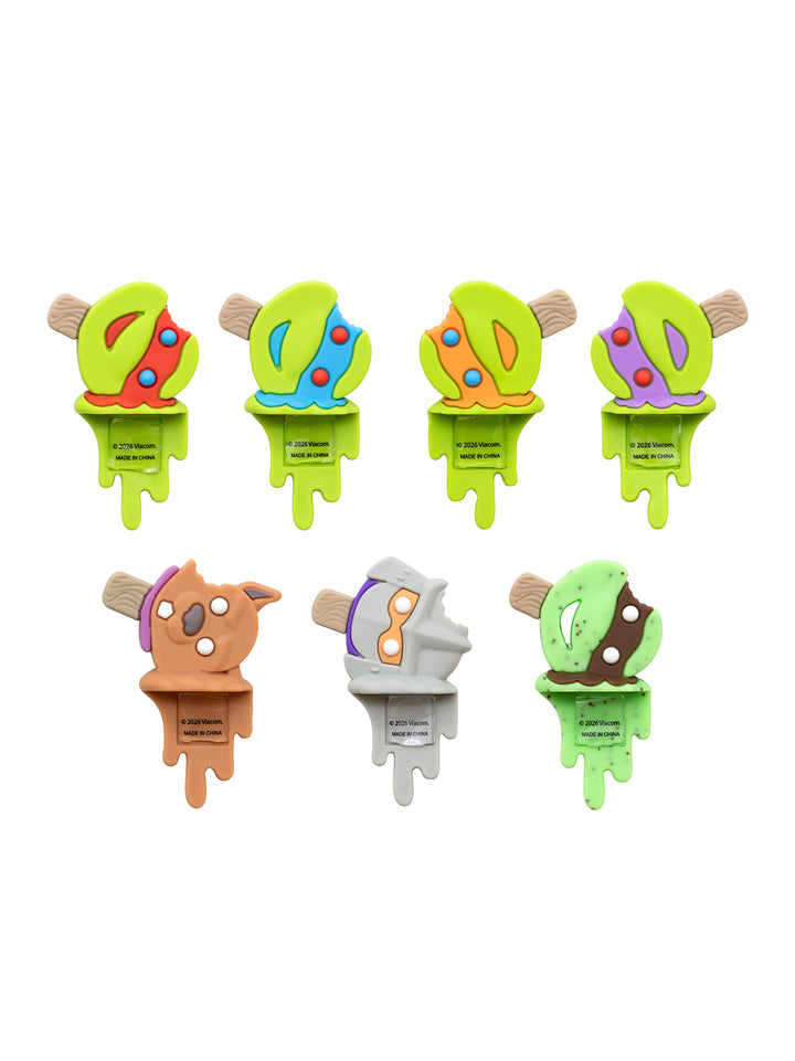 Seven colorful wooden popsicle-shaped toys arranged in two rows on a plain white background. Each toy has a bright green melting base and a different illustrated top design in various colors including red, blue, orange, purple, brown, and white.