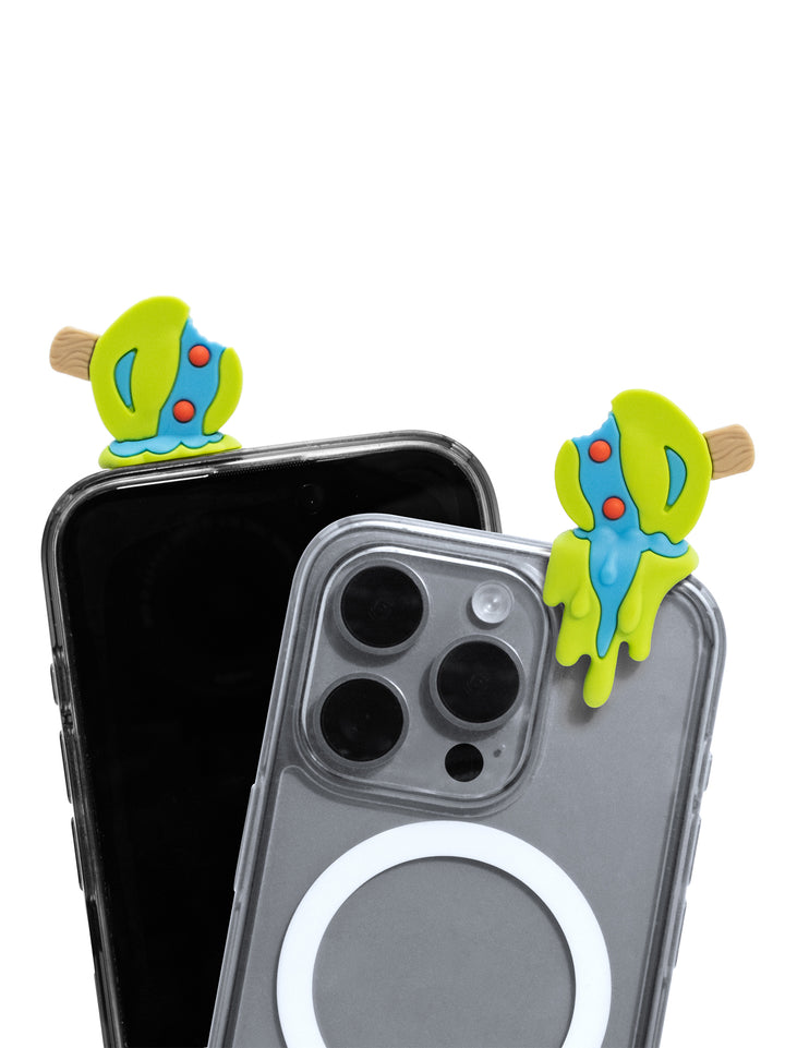 Two colorful ninja turtle phone accessories clipped onto the top corners of two smartphones, shown against a plain white background.