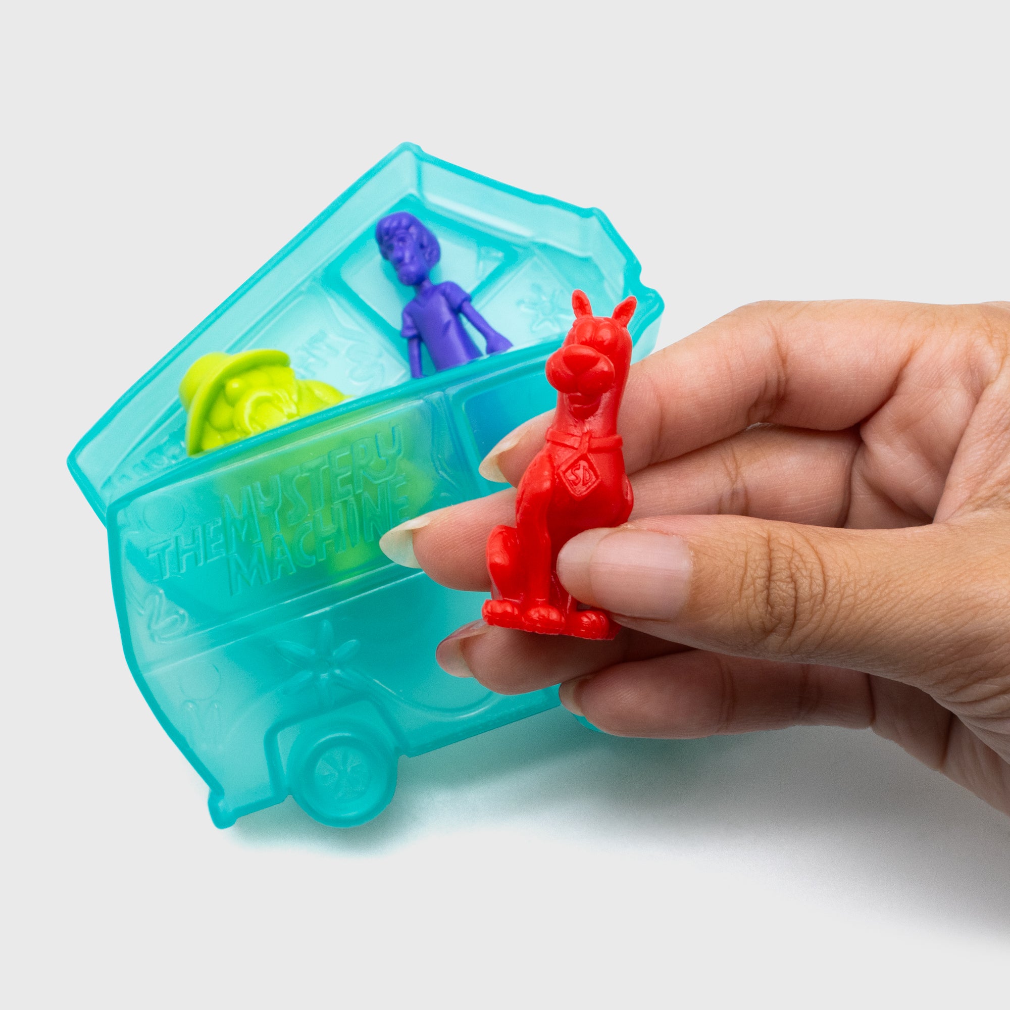 tiny mights scooby doo. 3 figures in one package. hand holding tiny might for scale.