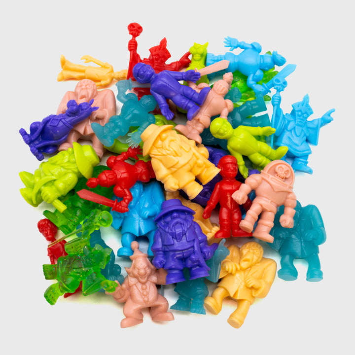 pile of different tiny might scooby doo characters and variants.