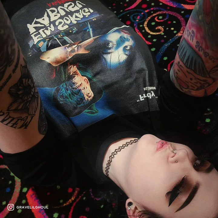 woman upside down on floor wearing nightmare on elm street shirt