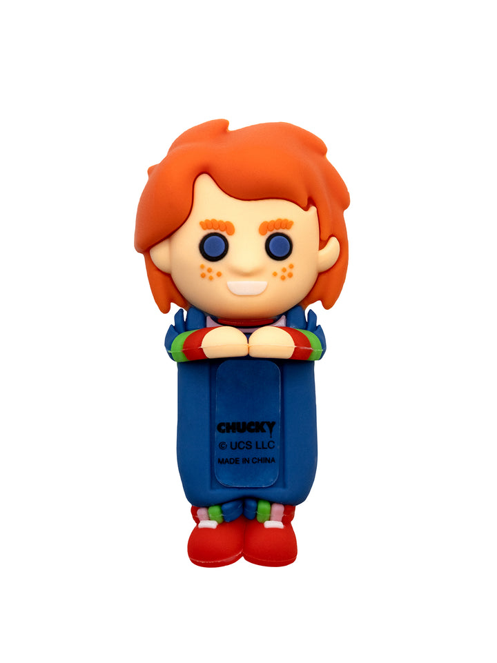 Toy figure of a character with red hair and blue overalls on a white background