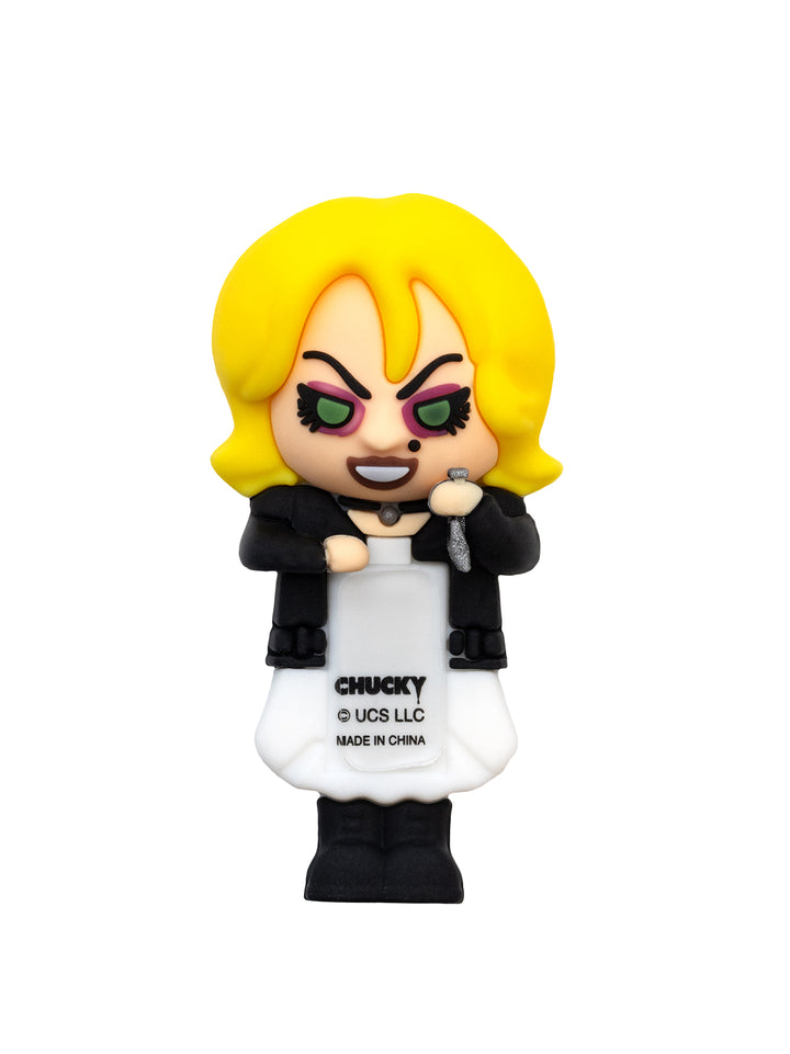 Vinyl figure with blonde hair and black jacket on a white background