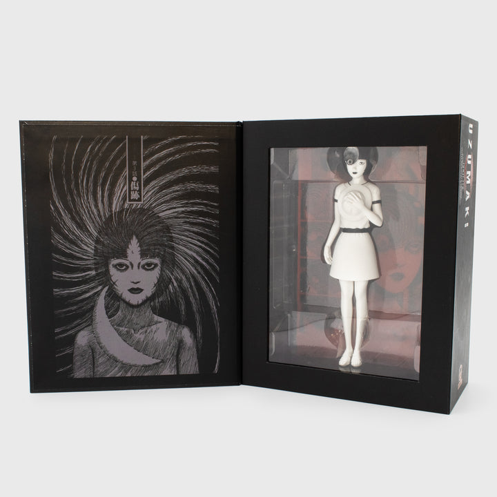uzumaki azami figure inside of packaging. the inside cover of box shows the manga panel of azami with moon scar on forehead.