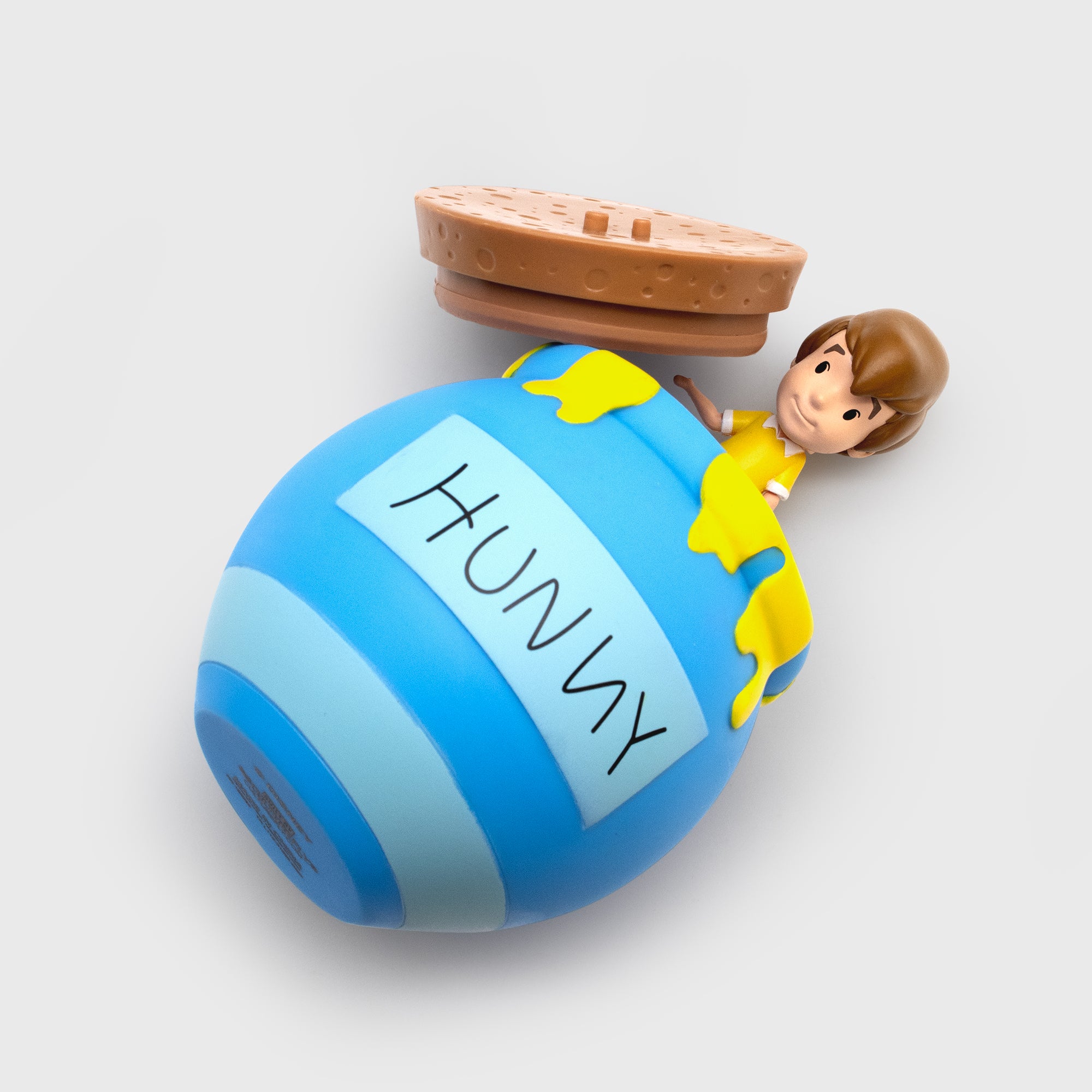shows hunny pot packaging open with christopher robin