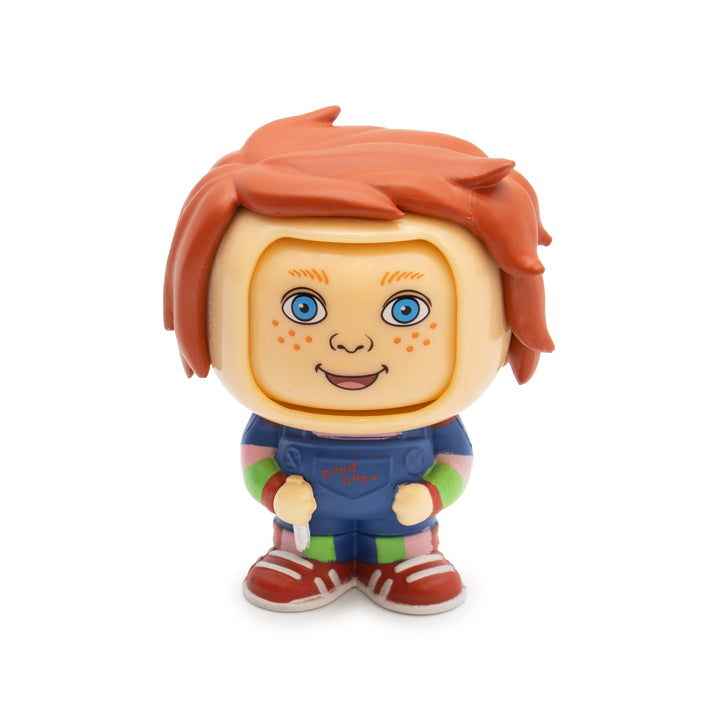 Toy figure with red hair and blue eyes on a white background