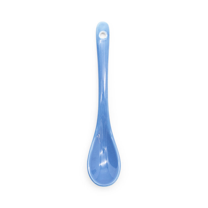 Blue spoon on a white background