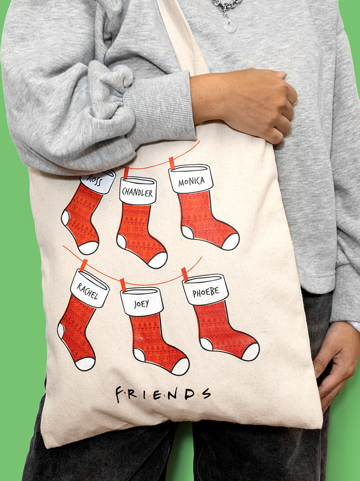friends tote bag. christmas stockings with ross, chandler, monica, rachel, joey, and phoebe on them
