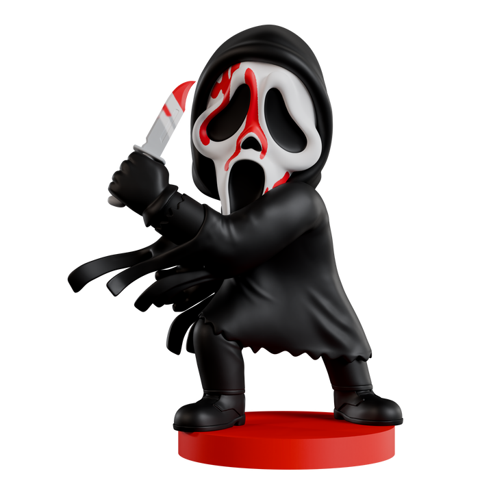 Figurine of a character with a black hood and red mask holding a knife on a white background