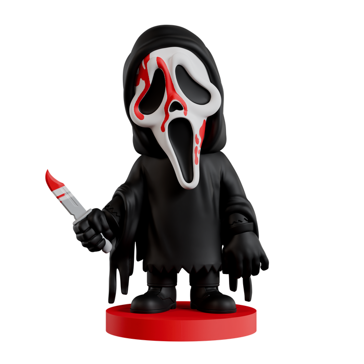 Figurine of a character with a black hood and red base, holding a knife.