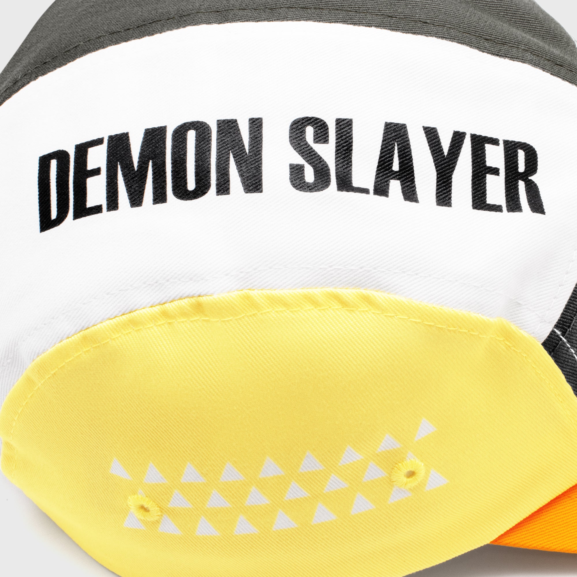 Top of hat. Black letters on white. Text: Demon Slayer