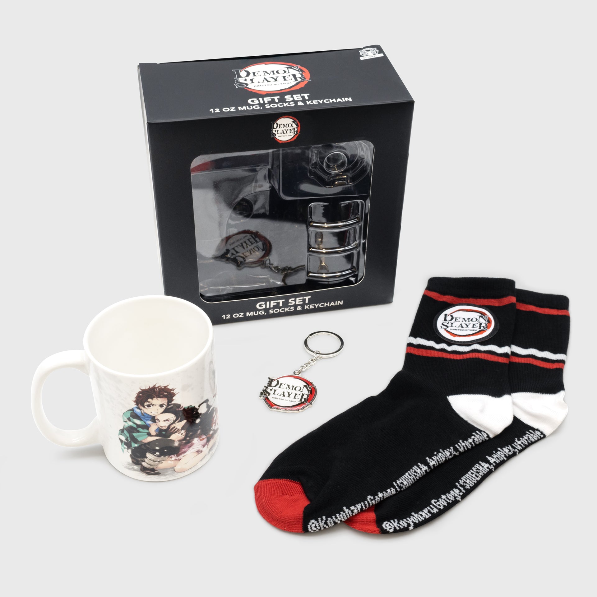 demon slayer gift bundle full reveal. text on box: demon slayer gift set, 12 oz mug, socks and keychain.