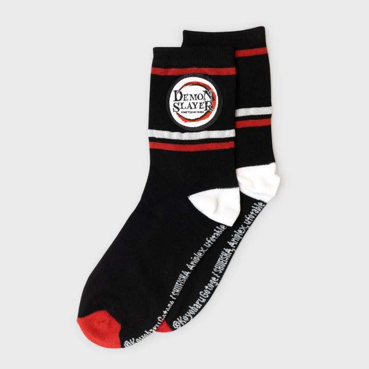 socks with stripes on top and demon slayer logo.