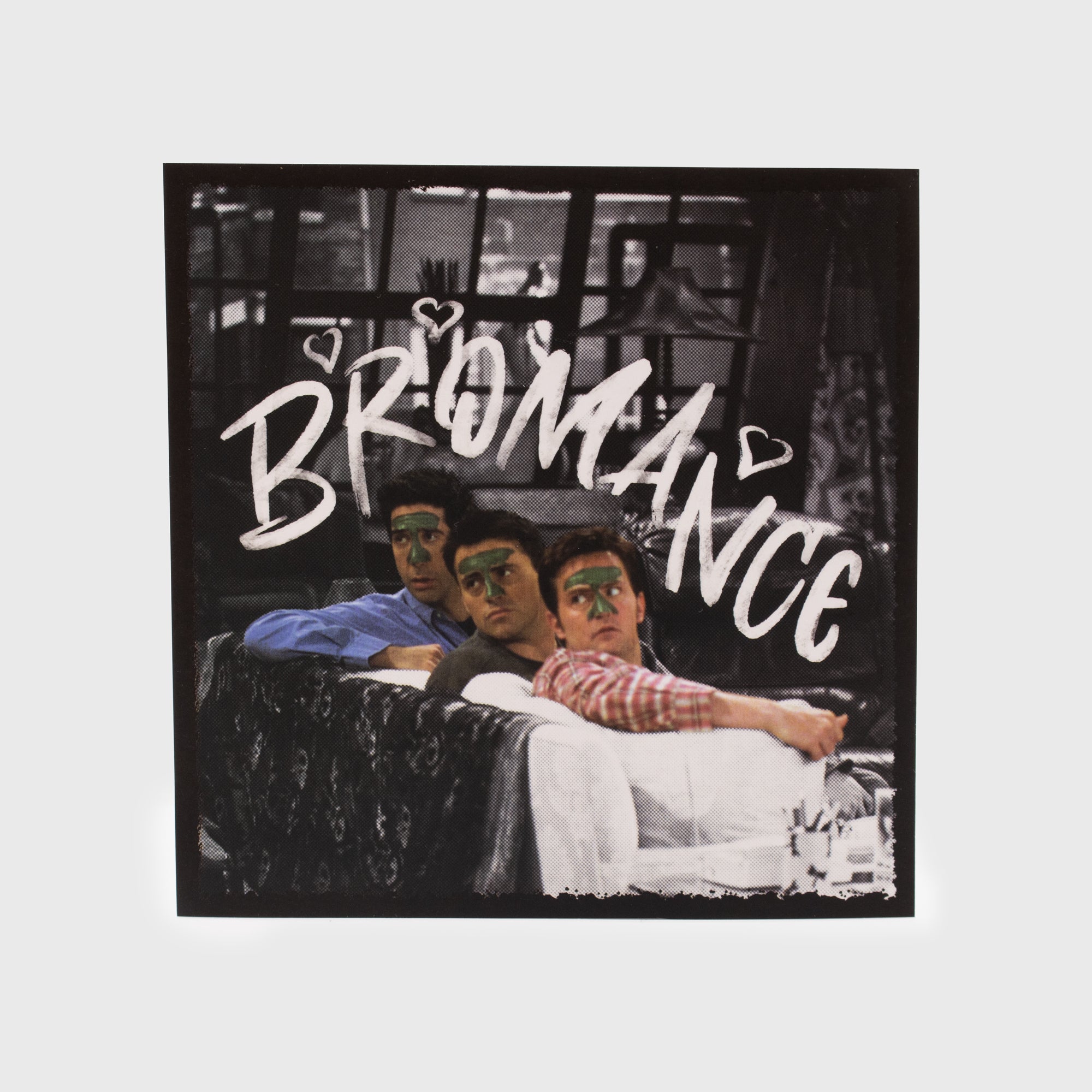 big sticker. features ross, joey, and chandler wearing clay face masks. text: bromance.