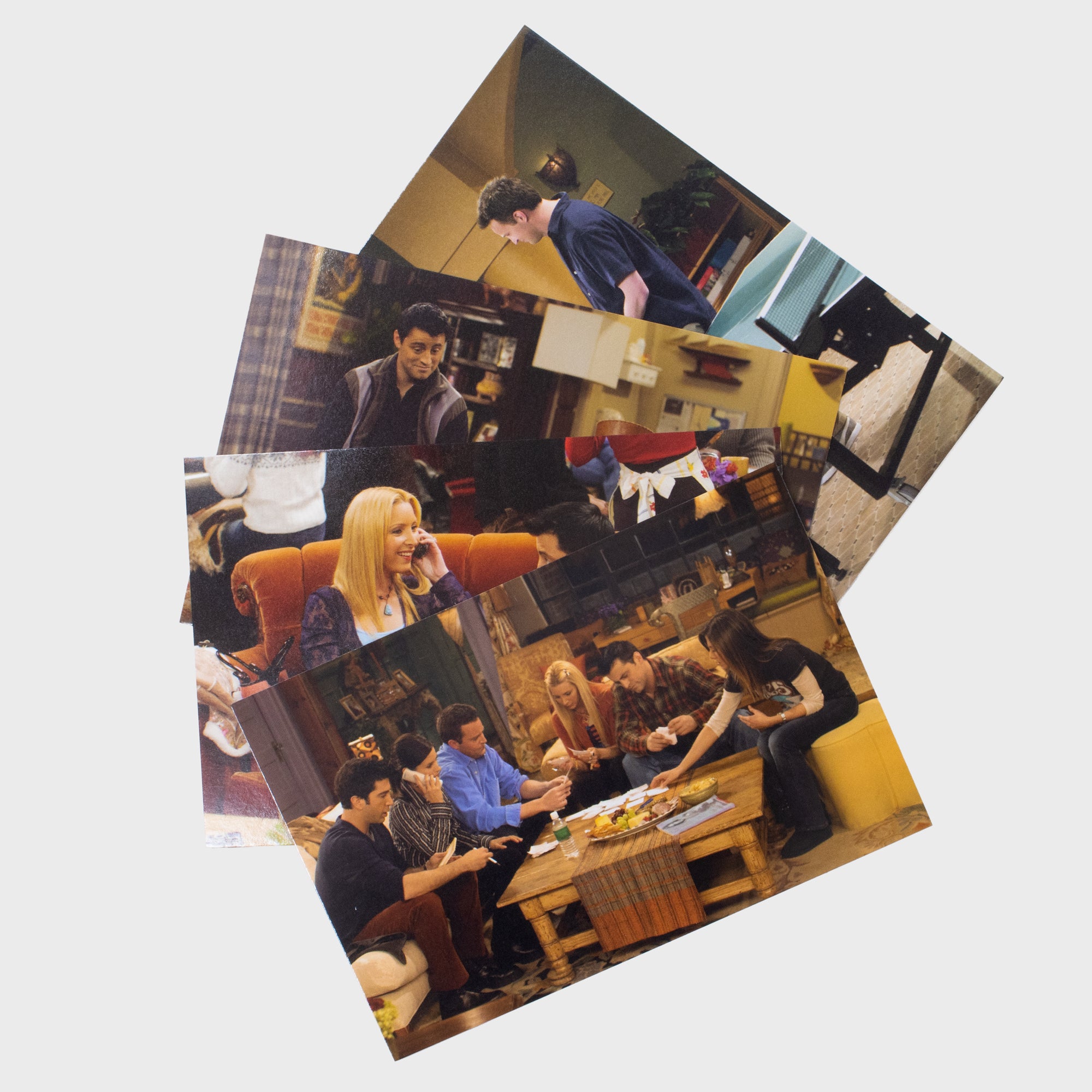 4 postcard set. one has all the friends cast playing a game on a couch. other ones not fully shown in picture.