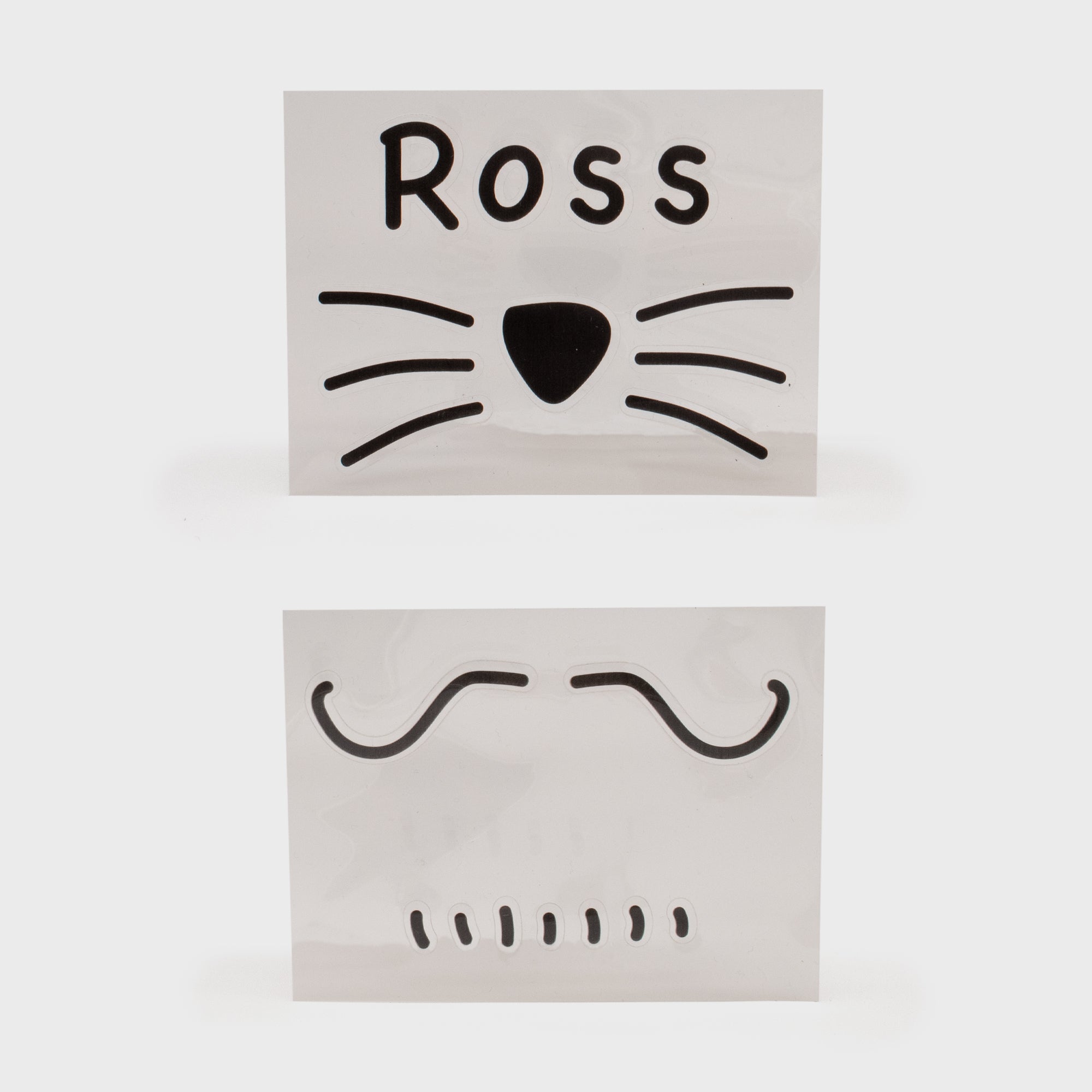 friends face stickers. set of 2. one: ross with cat whiskers and nose. other: mustache with lines for beard.