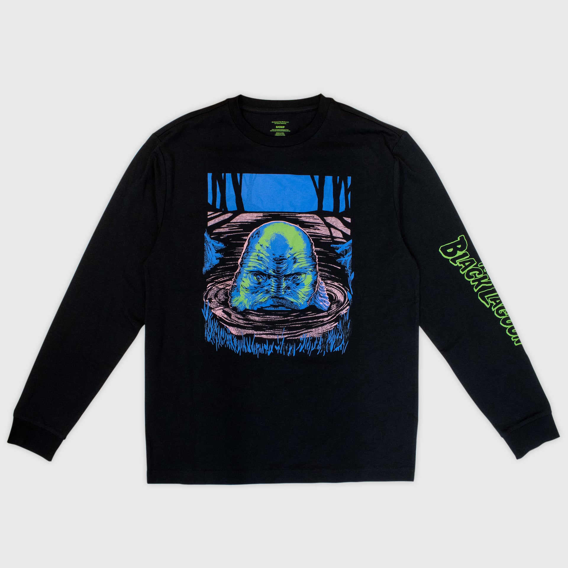 horror haul long sleeve tee. image on front: creature peeking head out of water. text on left sleeve: creature from the black lagoon