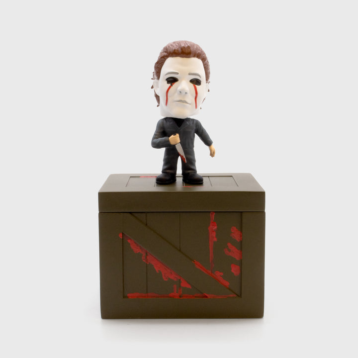 horror haul halloween 2 michael myers collectible smols figure standing on crate base. michael myers with blood dripping down mask eyes holding knife.