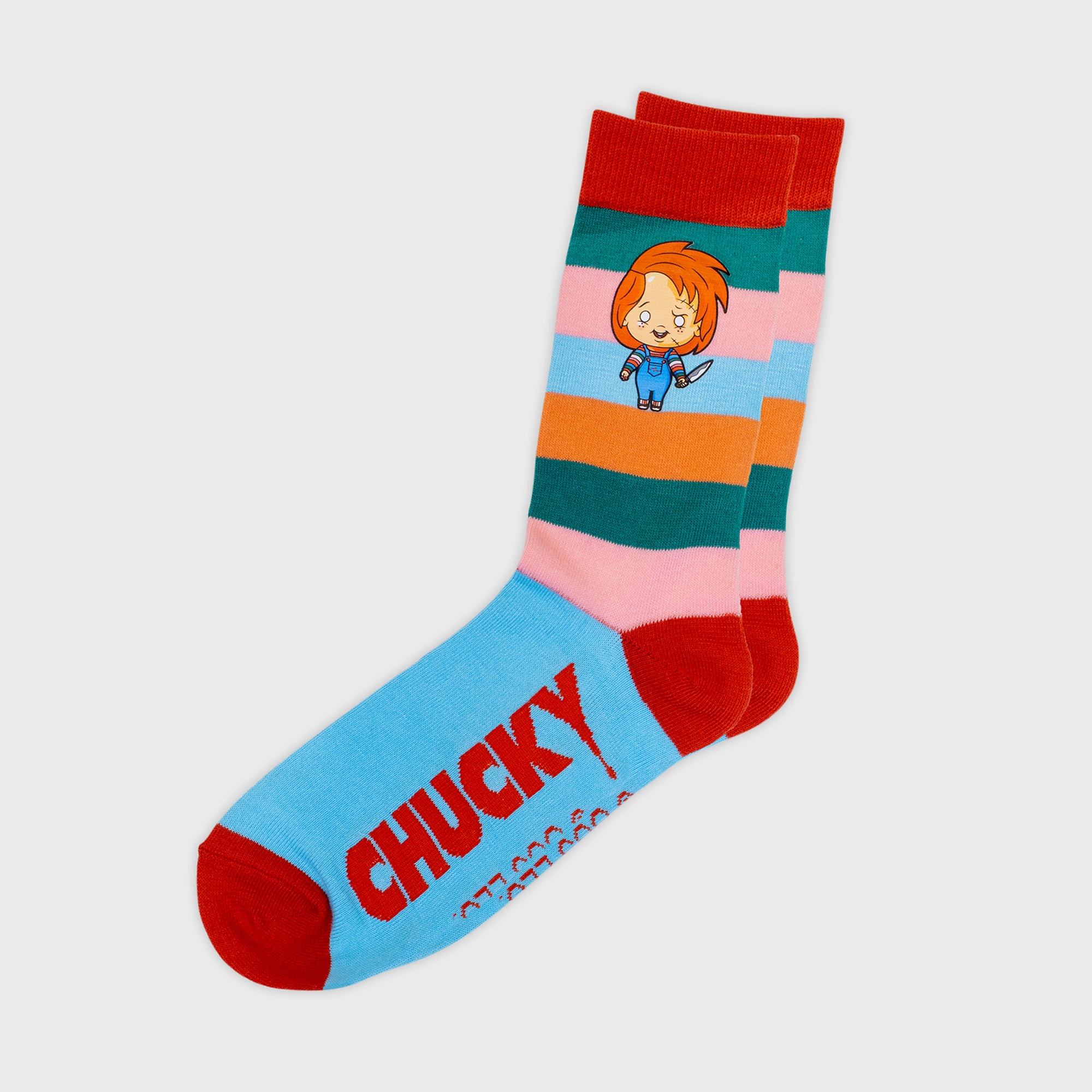 horror haul chucky socks. top of socks: strips with image of chucky with knife. bottom: text says chucky.