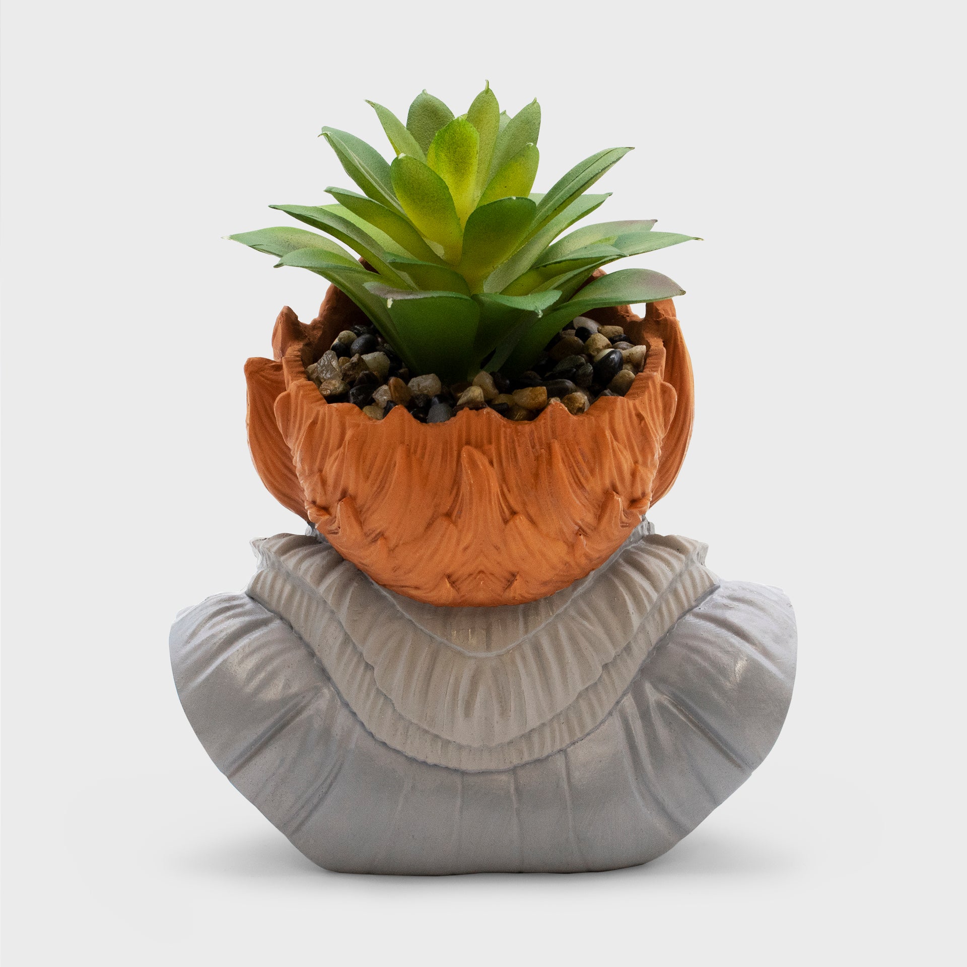 back of planter. plant goes into his head.