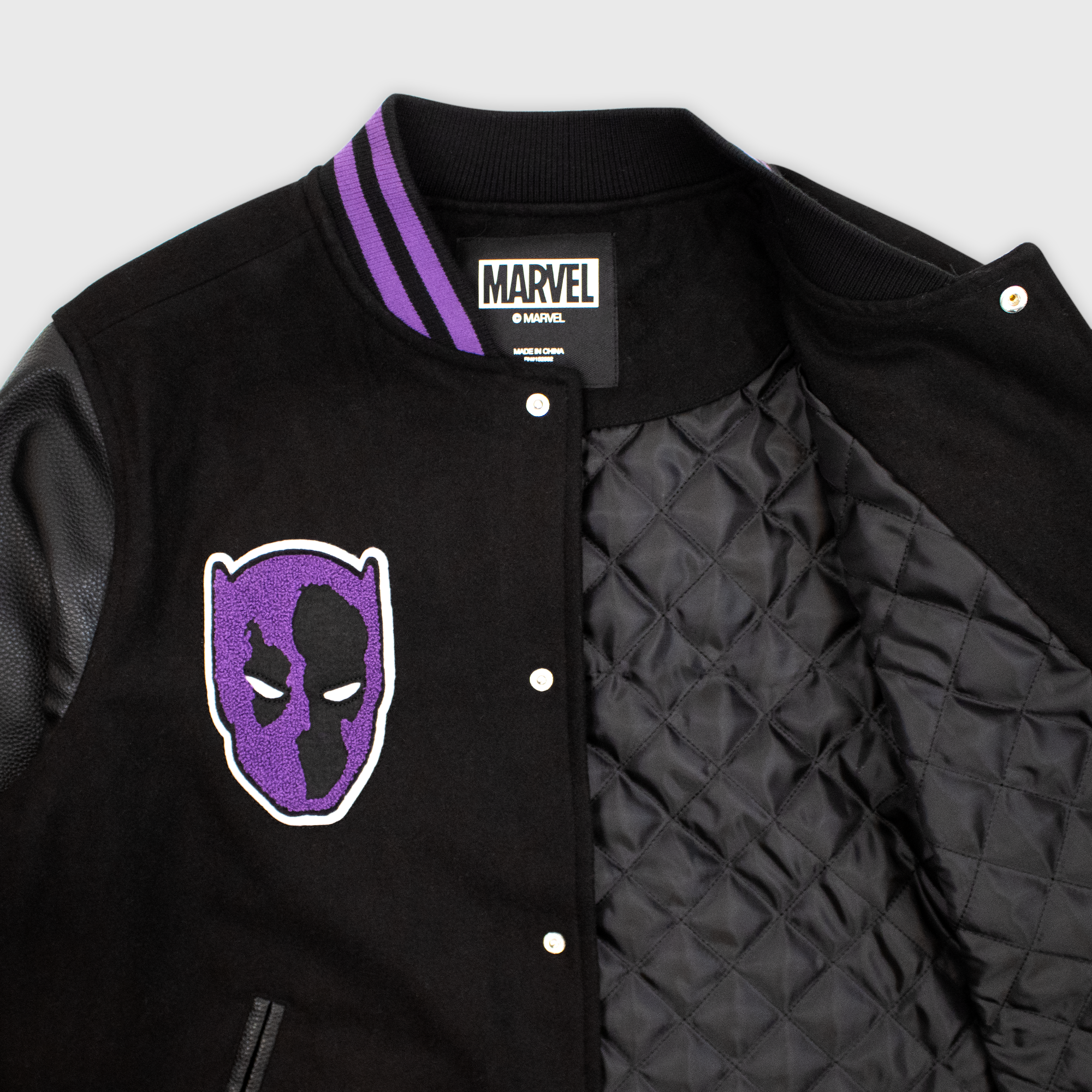 close up of inside of jacket. black wool inside.