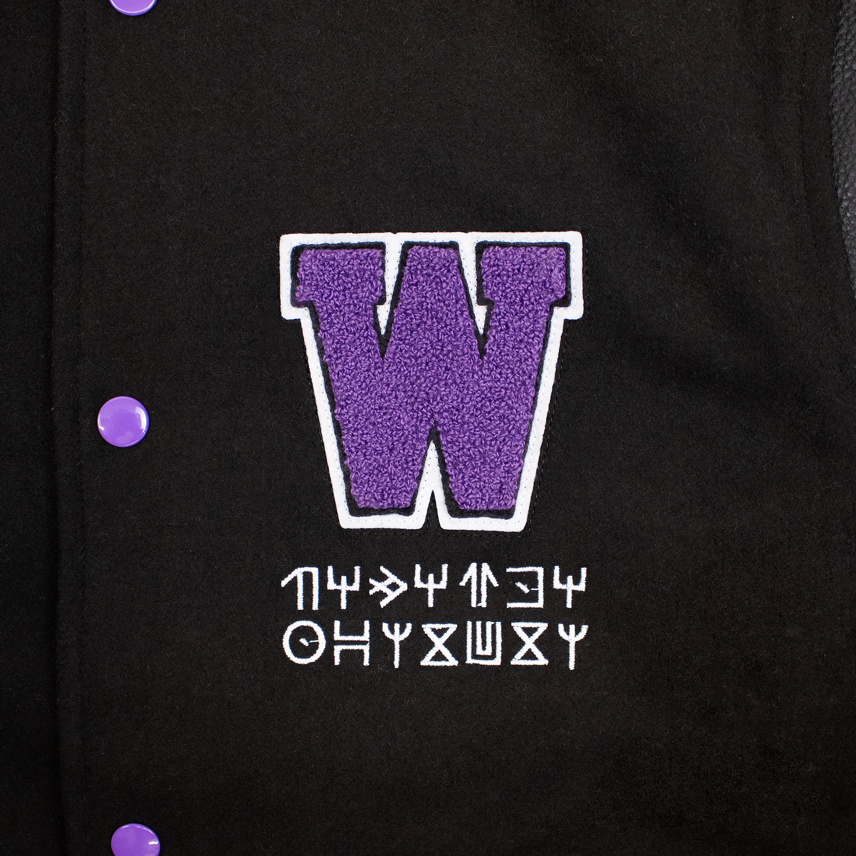 close up of purple W patch