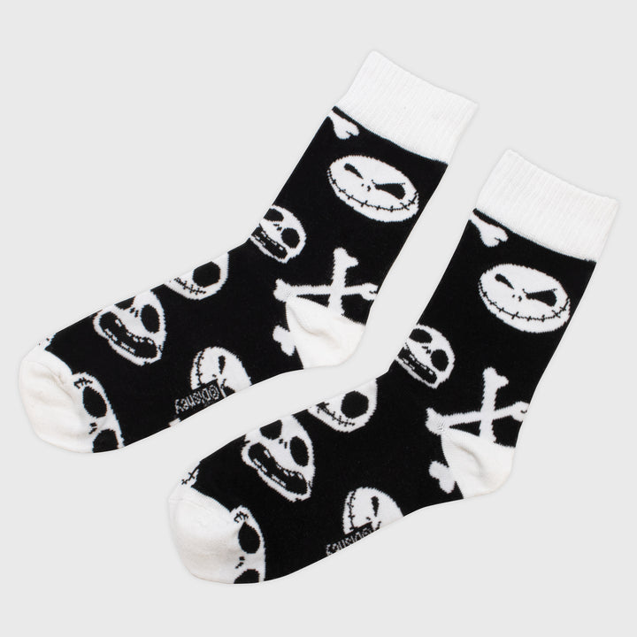 nightmare before christmas crew socks. pattern: jack skeletons faces and cross bones.
