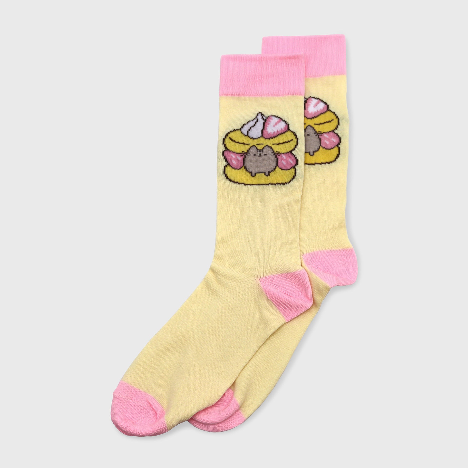 2 yellow and pink socks. image on socks: pusheen in a pastry with strawberries