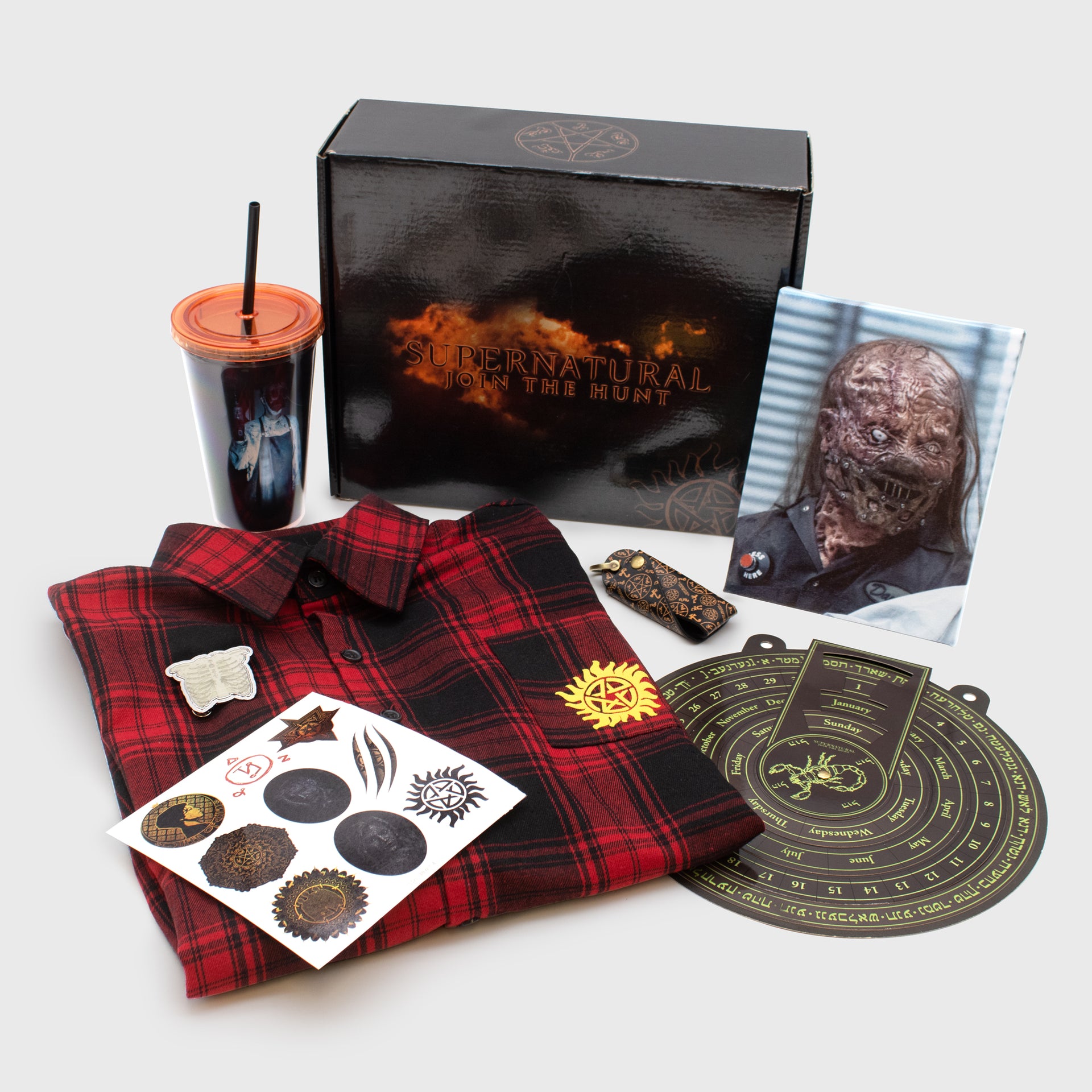 supernatural spookynatural full box. plaid shirt, hatchet man canvas print, tumbler, disk calendar, key organizer, pin, temporary tattoos