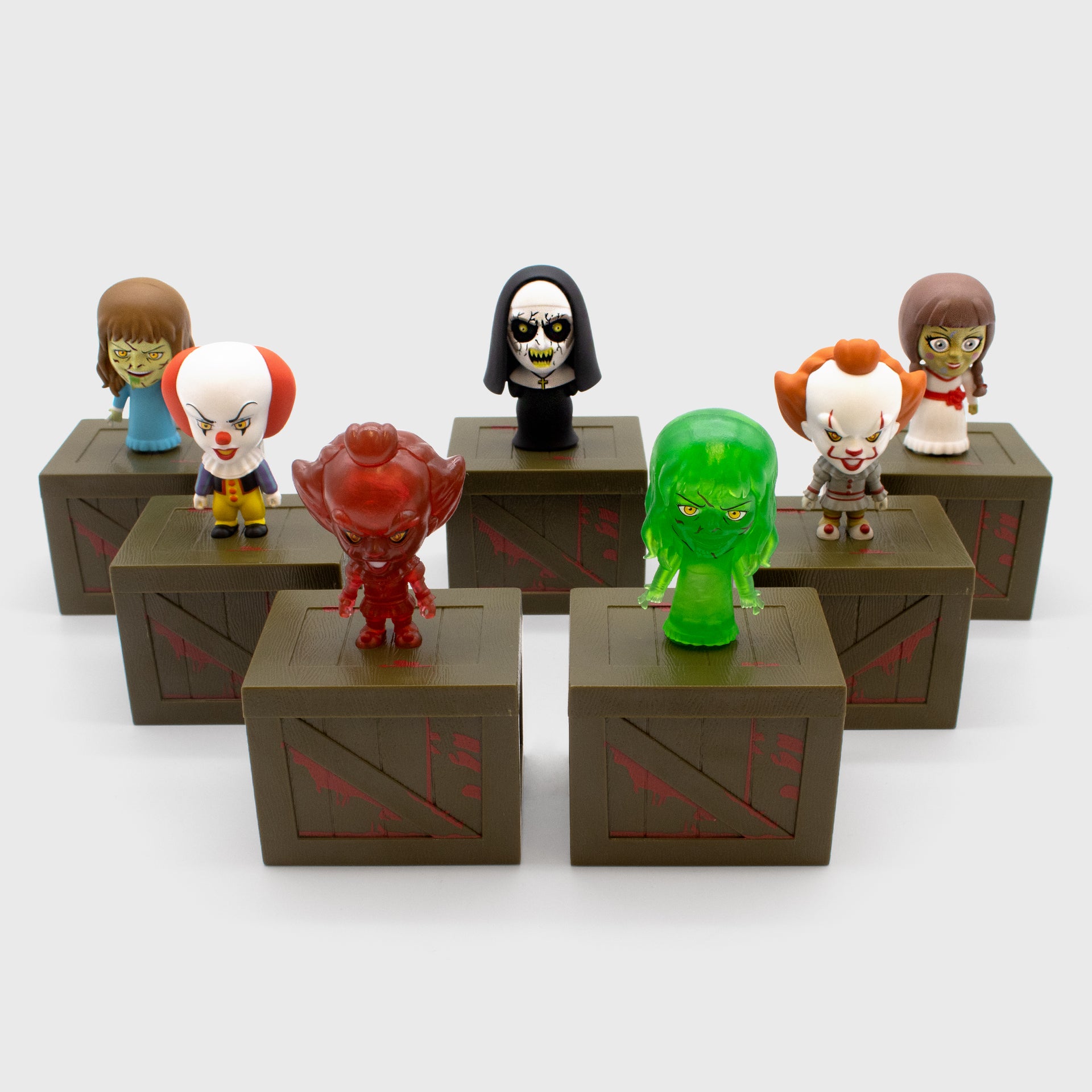 Full set of Horror Smols. Includes Pennywise (1990), Pennywise (2017), Translucent Red Pennywise (2017), The Nun, Annabelle,  Regan, Translucent Green Regan 