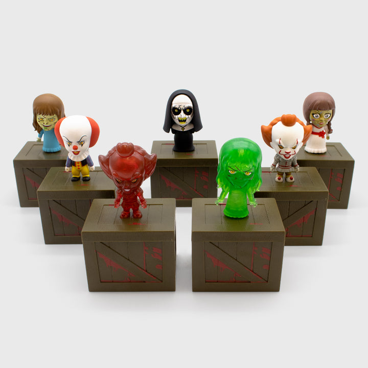 Full set of Horror Smols. Includes Pennywise (1990), Pennywise (2017), Translucent Red Pennywise (2017), The Nun, Annabelle,  Regan, Translucent Green Regan 