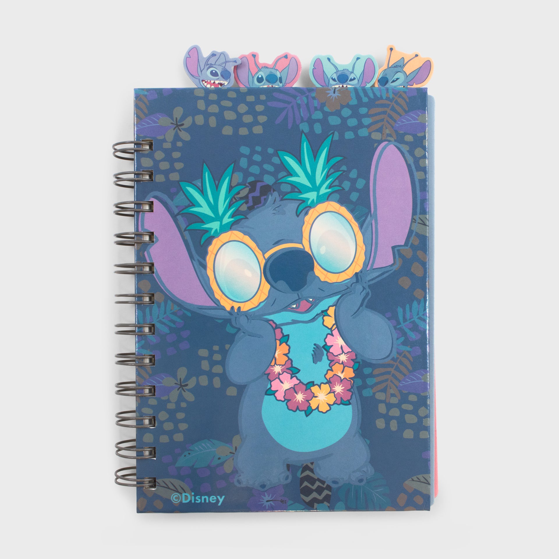 outside of stitch notebook. stitch on cover wearing a lei around his neck and pineapple sunglasses.