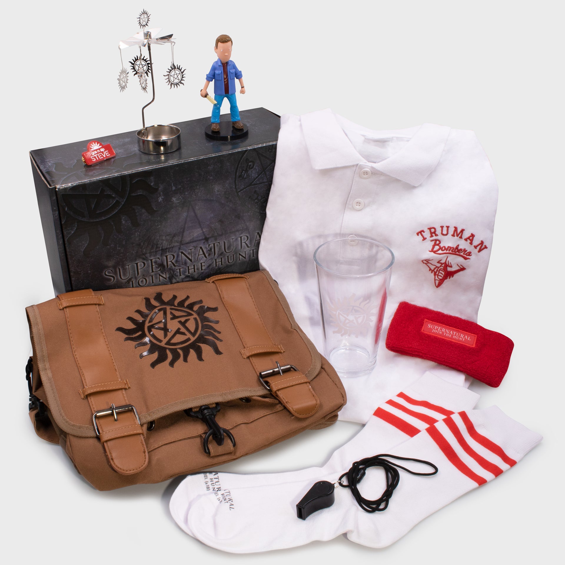 supernatural collector's box. messenger bag, polo shirt, sweatband, whistle, socks, point glass, dean vinyl figure, candle mobile, pin