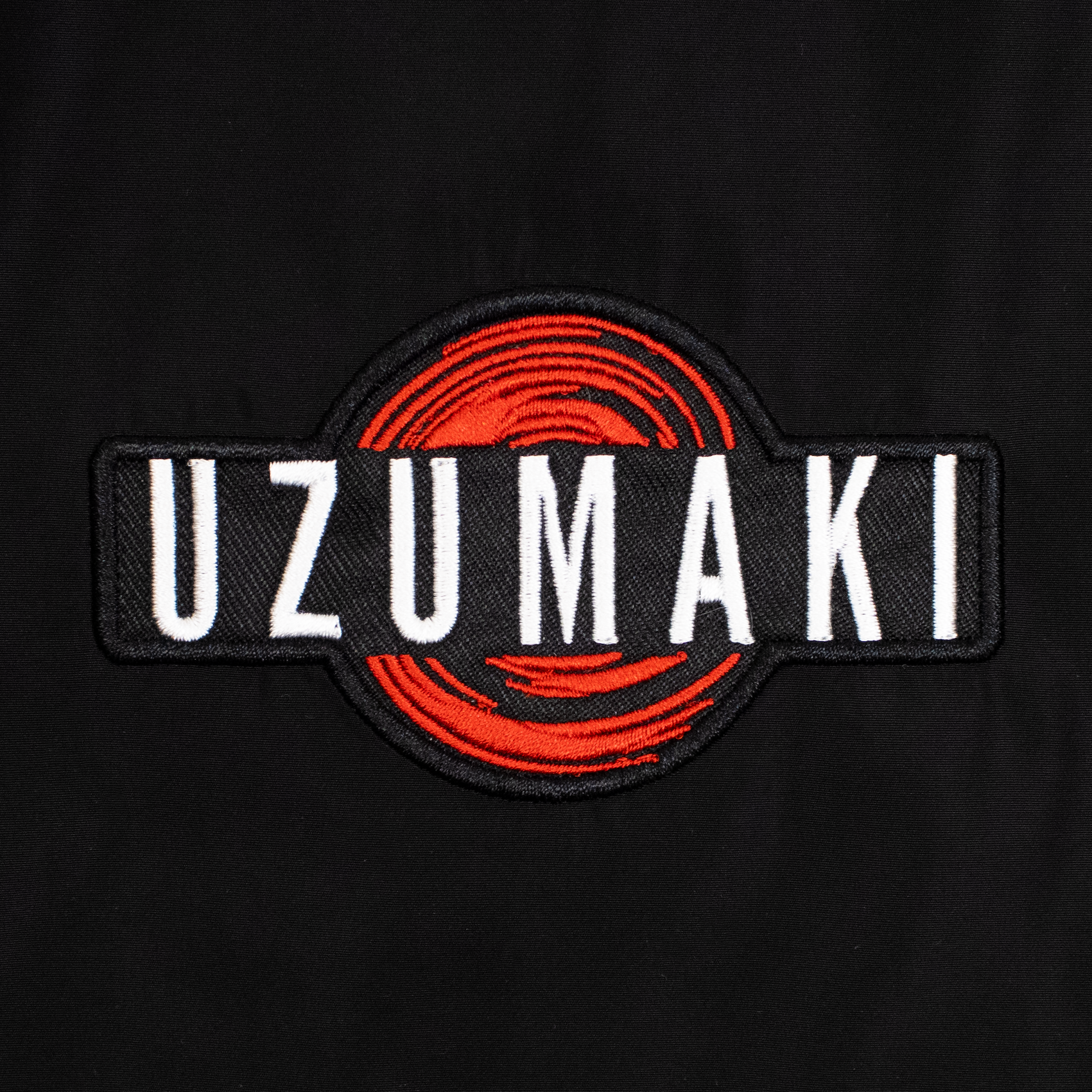 uzumaki bomber jacket patch. text: uzumaki
