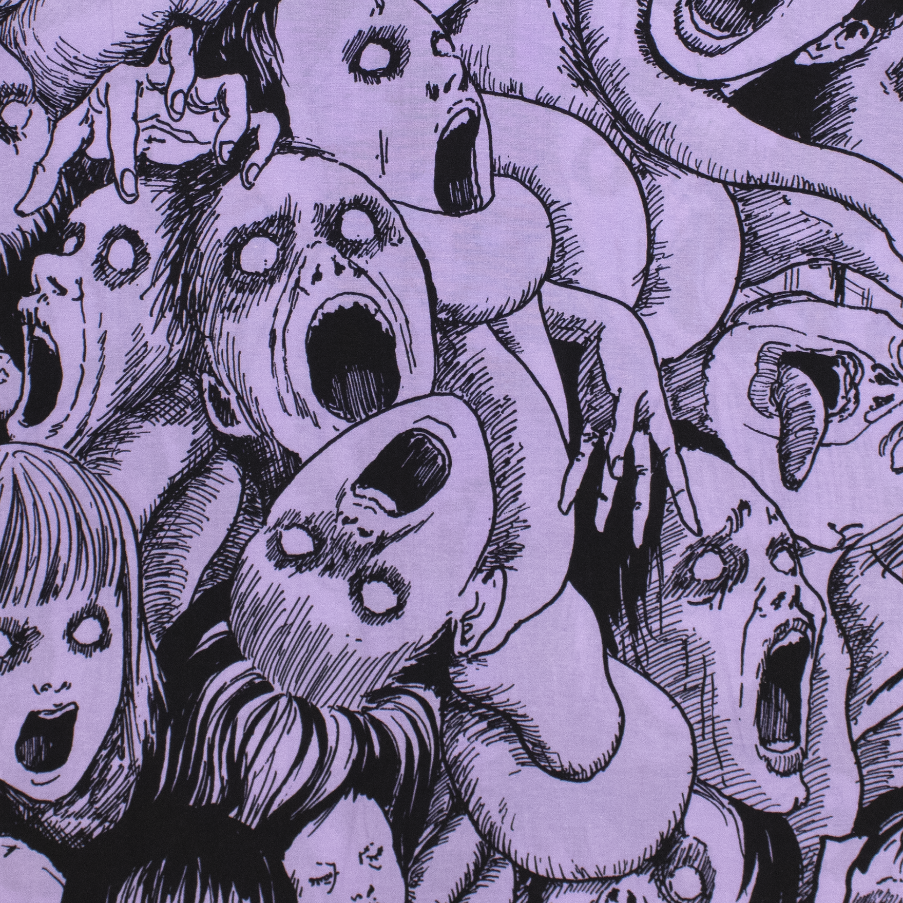 close up of all over faces print button down. purple with black faces.